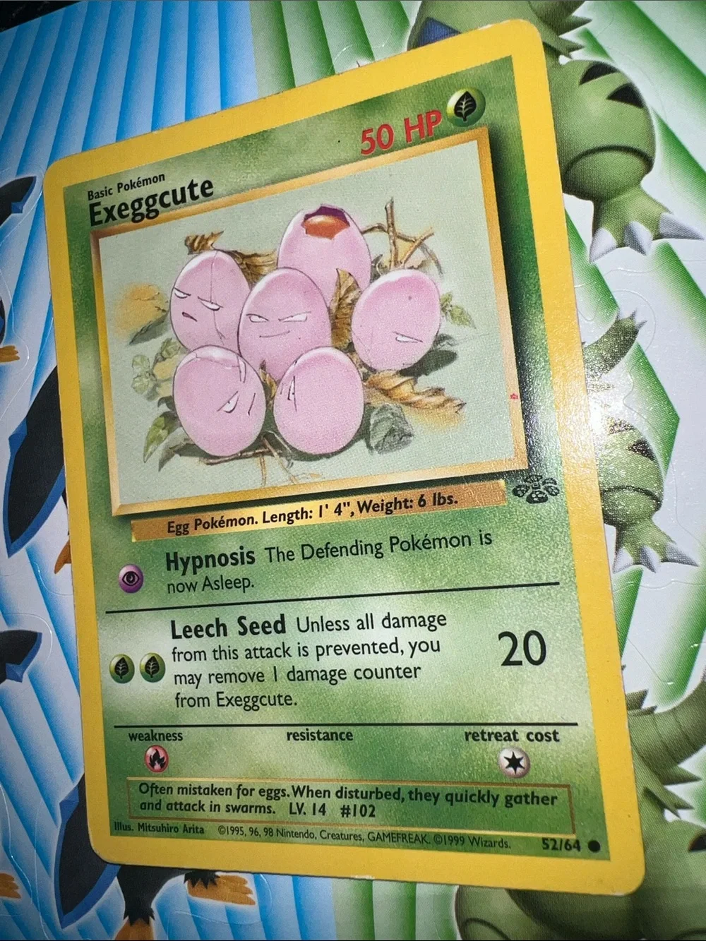 Pokemon Exeggcute Card — Pink Eggs with Yellow Border and Green Card Face